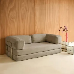 Divano letto futon in velluto a coste e struttura cromata
