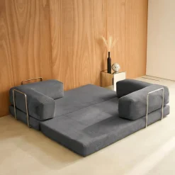 Divano letto futon in velluto a coste e struttura cromata