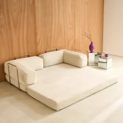 Divano letto futon in velluto a coste e struttura cromata