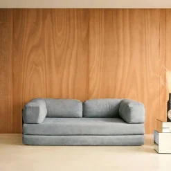 Divano letto futon in velluto a coste e struttura cromata