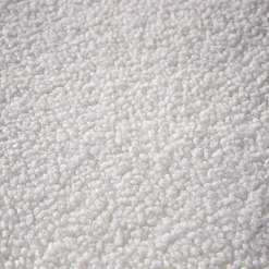 Poltrona letto bouclé con base in legno