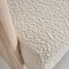 Poltrona scandinava in legno e tessuto bouclé testurizzato