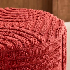 Pouf rotondo in bouclé testurizzato