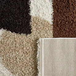 Tappeto interno shaggy motivi circolari beige, marrone, nero